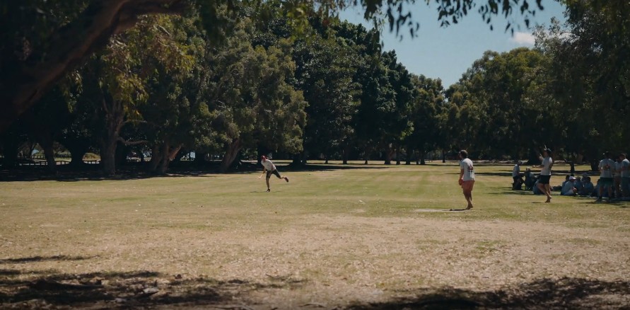 Members playing games together in the park