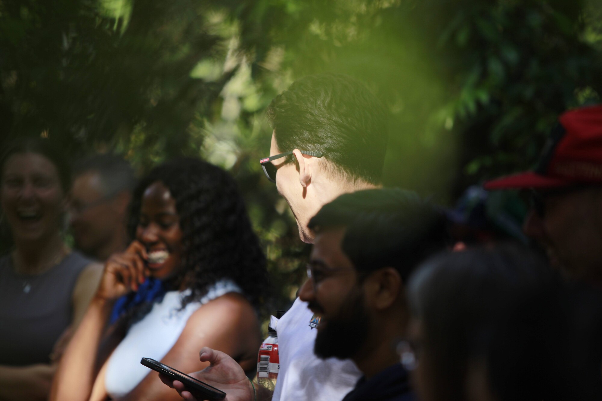 Members laughing together during an outdoor session