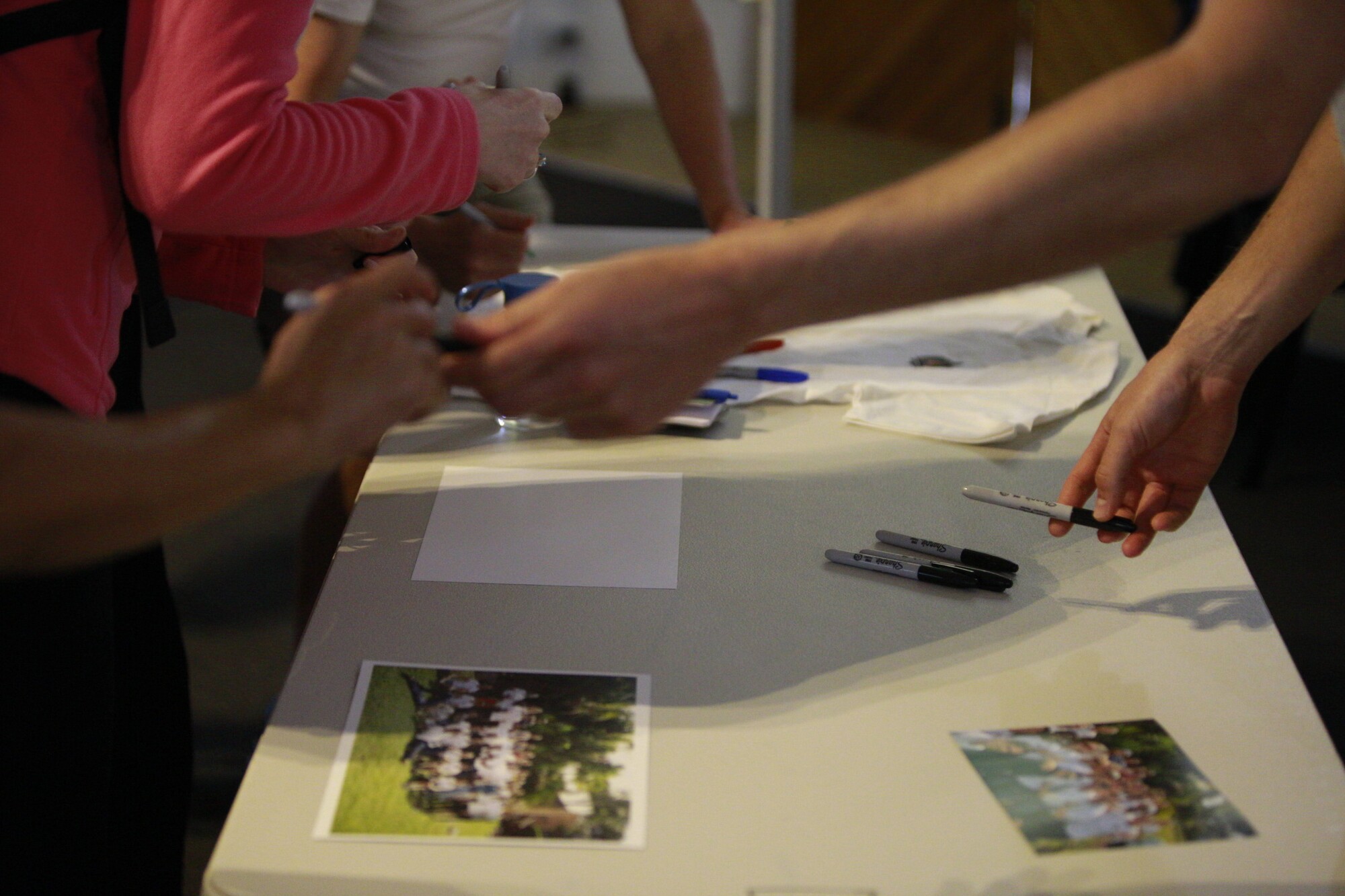 Hands working through a mapping exercise at a workshop table
