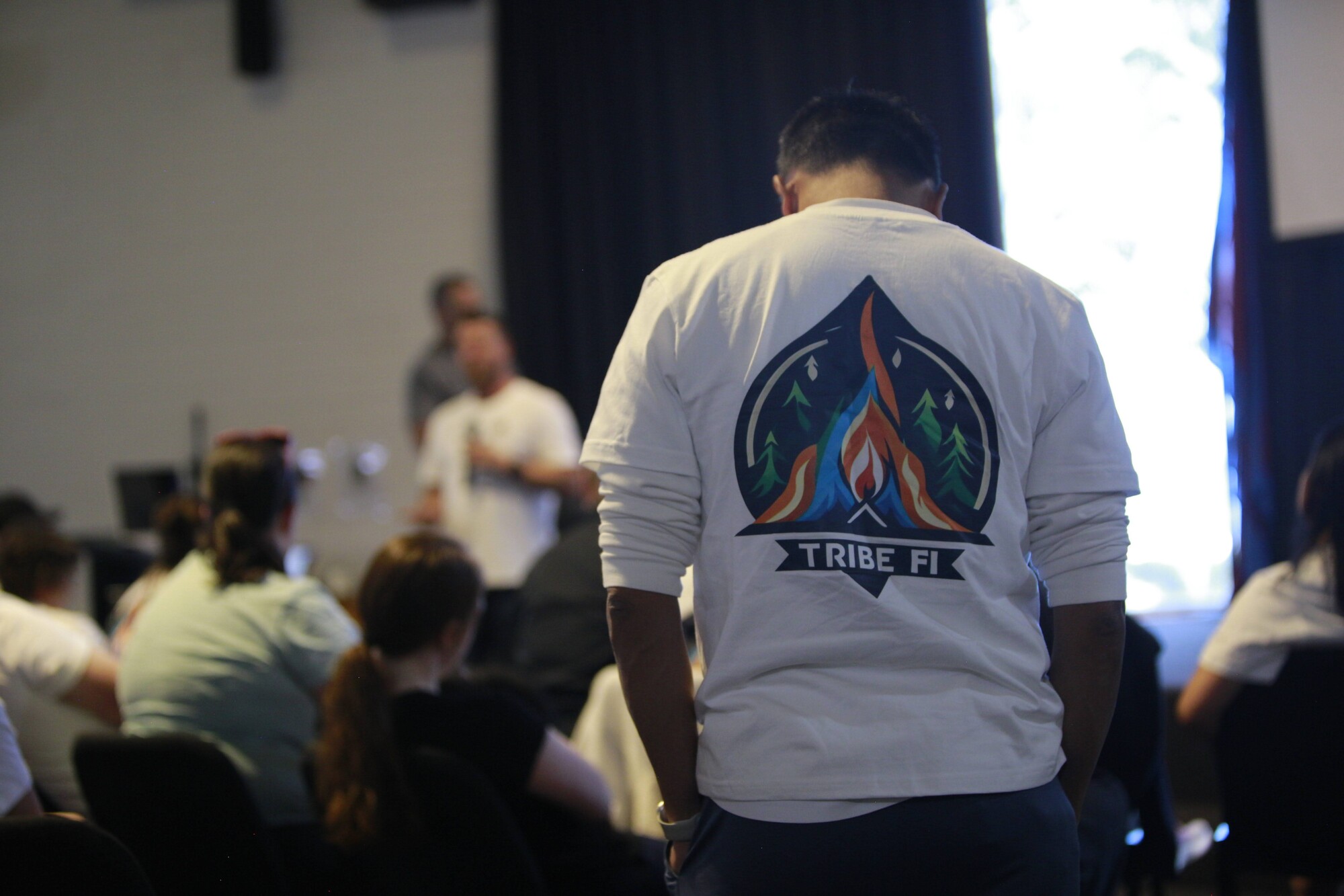 A member presenting to the room during a session